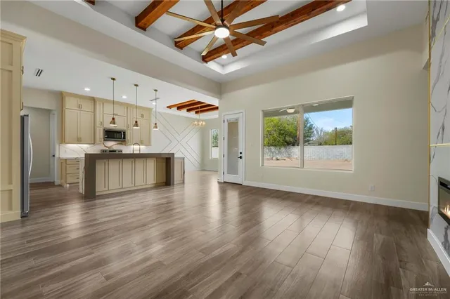 a view of a kitchen with a sink and a stove top oven