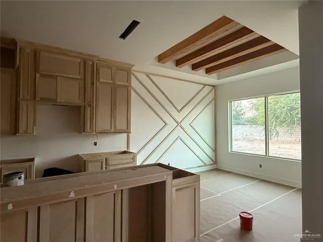 a kitchen that has a sink and a window in it