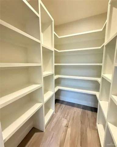 a view of an entryway with wooden floor