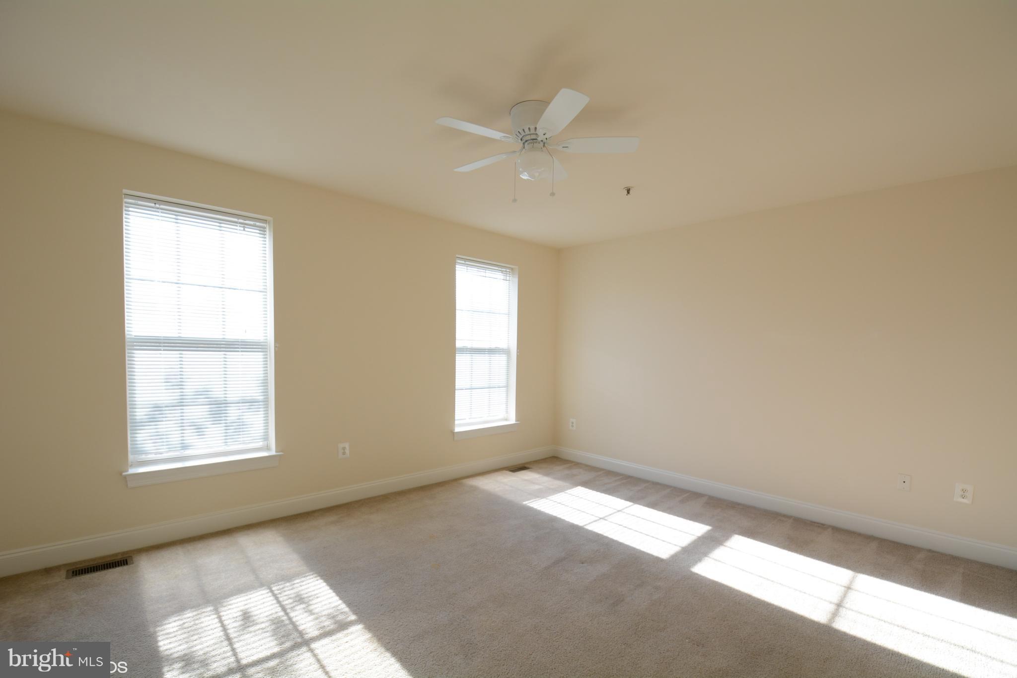 4110 Potomac Highlands Circle, Unit 5 Triangle, VA 22172 - Photo 13 of 24 an empty room with windows