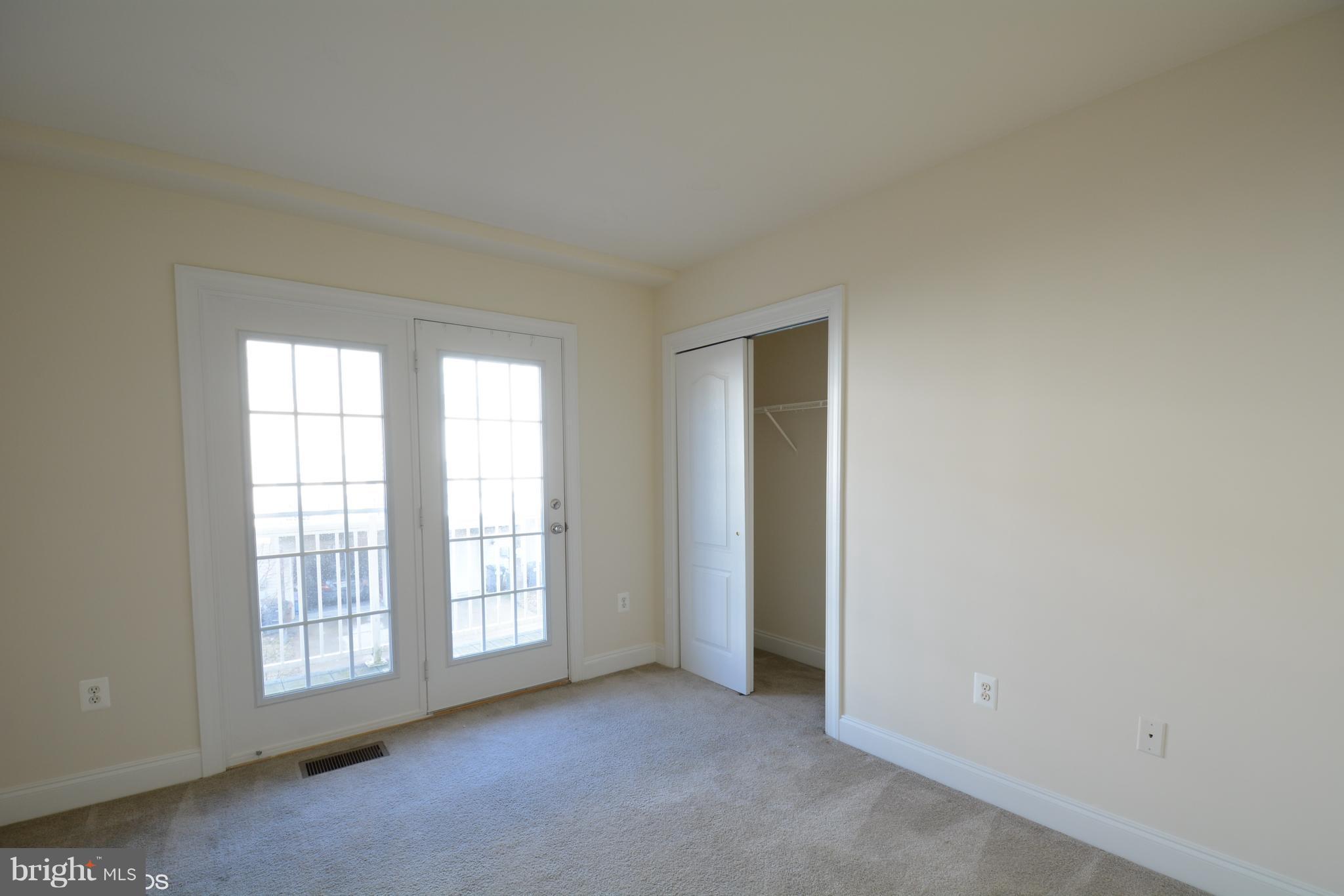 4110 Potomac Highlands Circle, Unit 5 Triangle, VA 22172 - Photo 16 of 24 an empty room with windows