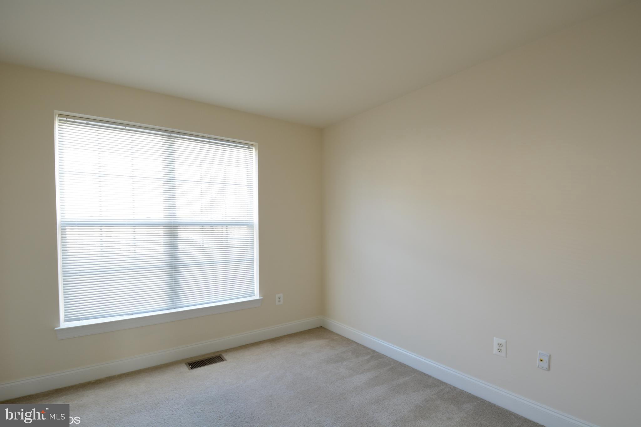 4110 Potomac Highlands Circle, Unit 5 Triangle, VA 22172 - Photo 17 of 24 an empty room with a window