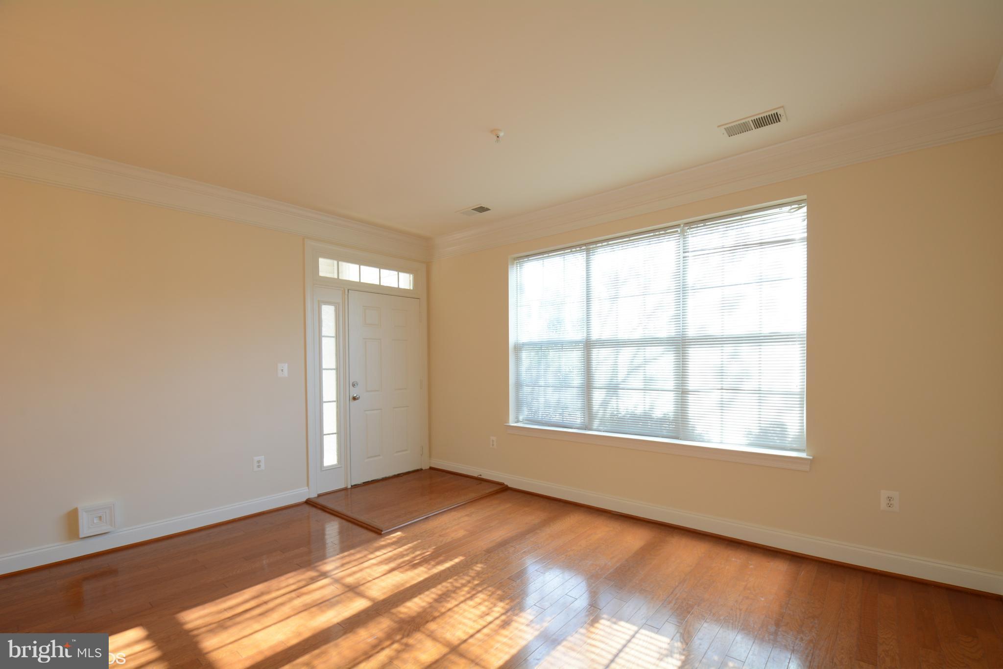 4110 Potomac Highlands Circle, Unit 5 Triangle, VA 22172 - Photo 3 of 24 a view of an empty room with a window