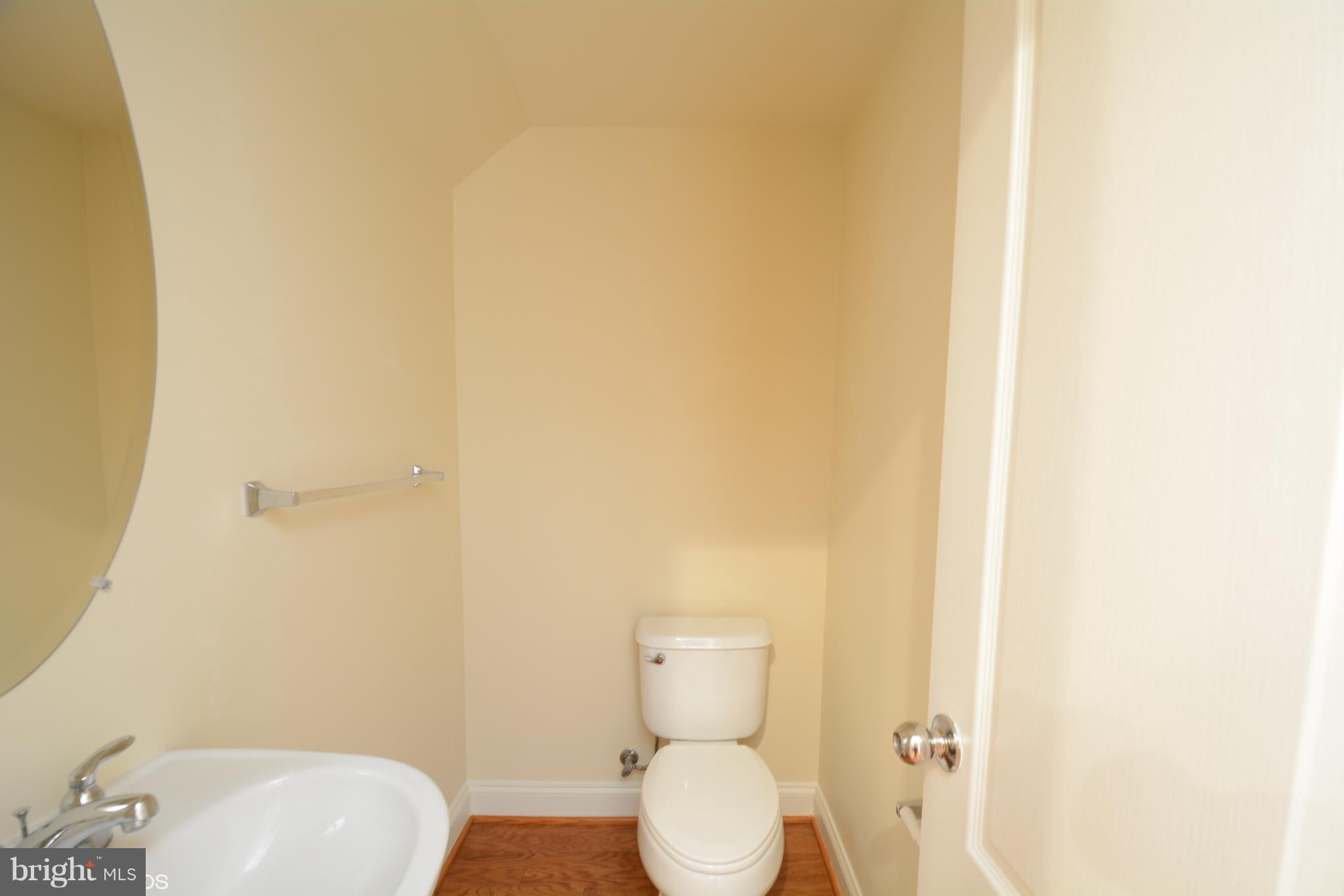 4110 Potomac Highlands Circle, Unit 5 Triangle, VA 22172 - Photo 21 of 24 a white toilet sitting next to a white sink
