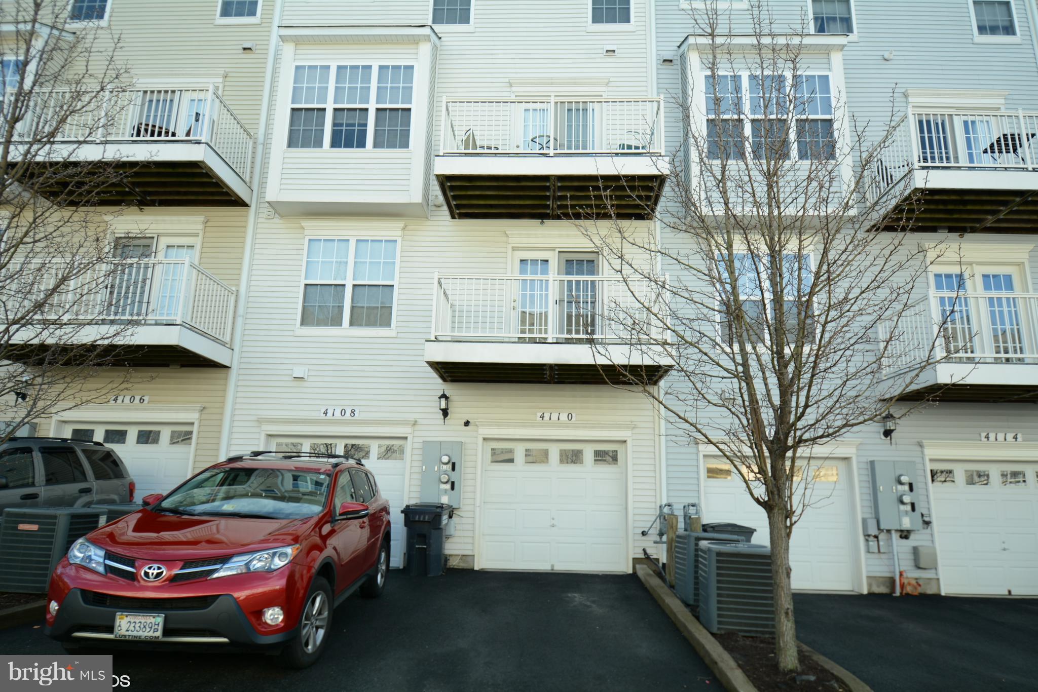 4110 Potomac Highlands Circle, Unit 5 Triangle, VA 22172 - Photo 23 of 24 a front view of a house with parking space