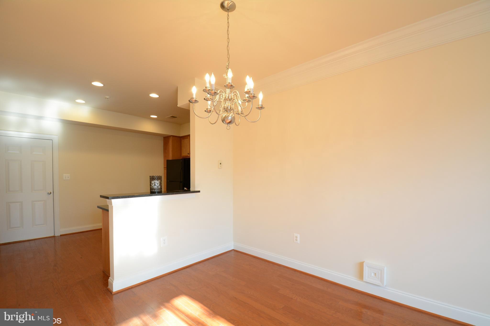4110 Potomac Highlands Circle, Unit 5 Triangle, VA 22172 - Photo 10 of 24 a view of a hallway with a chandelier