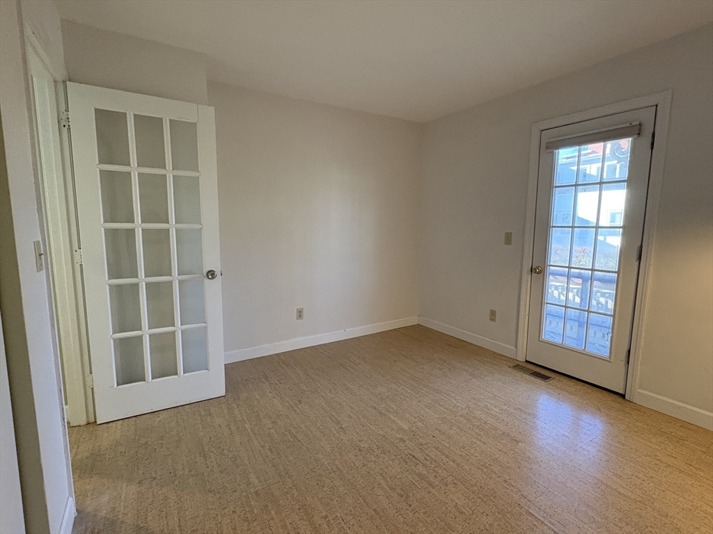 9 Walnut Street, Unit B Northampton, MA 01060 - Photo 17 of 25 an empty room with windows
