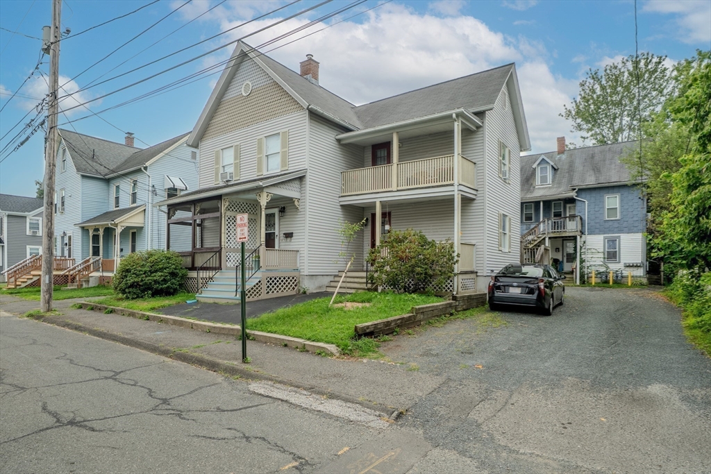 9 Walnut Street, Unit B Northampton, MA 01060 - Photo 20 of 25 a view of a brick house with a small yard and plants