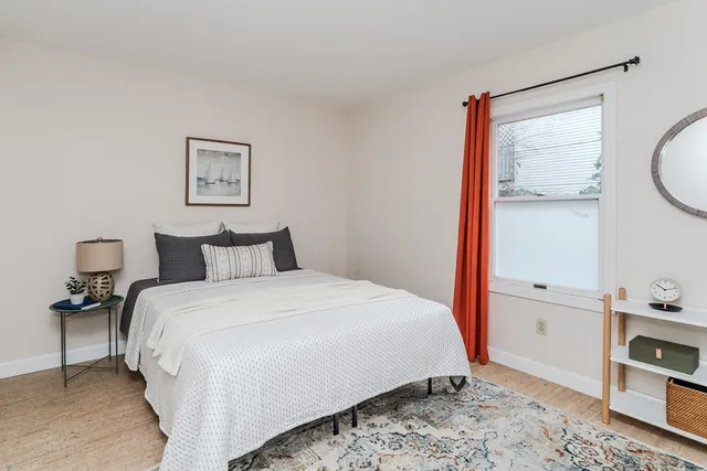 a bedroom with a bed and a view of bathroom