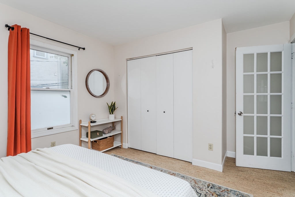 9 Walnut Street, Unit B Northampton, MA 01060 - Photo 7 of 25 a bedroom with a bed and a window