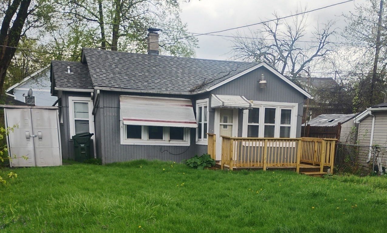 13816 Park Avenue, Unit COACH Dolton, IL 60419 - Photo 1 of 1 a view of a house with backyard and garden