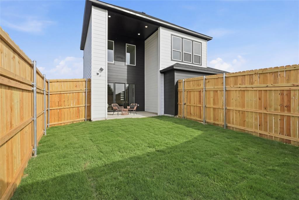 7817 Red Spring Road Dallas, TX 75241 - Photo 12 of 23 Rear view of property with a patio and a fenced backyard