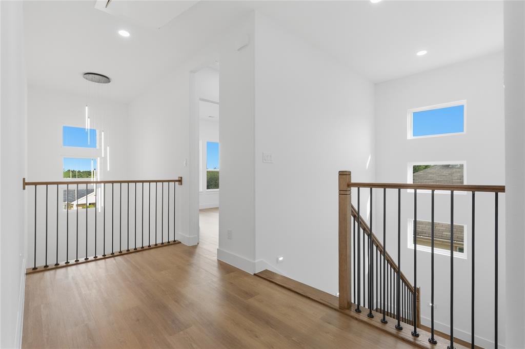 7817 Red Spring Road Dallas, TX 75241 - Photo 14 of 23 Hall featuring an upstairs landing, light wood-type flooring, and recessed lighting