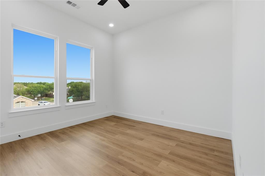 7817 Red Spring Road Dallas, TX 75241 - Photo 15 of 23 Empty room with light wood-style flooring, a ceiling fan, and recessed lighting