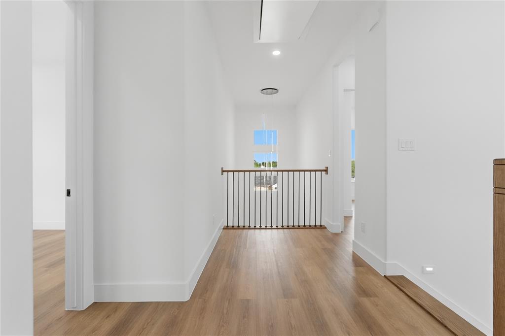 7817 Red Spring Road Dallas, TX 75241 - Photo 17 of 23 Corridor with light wood-style floors and recessed lighting