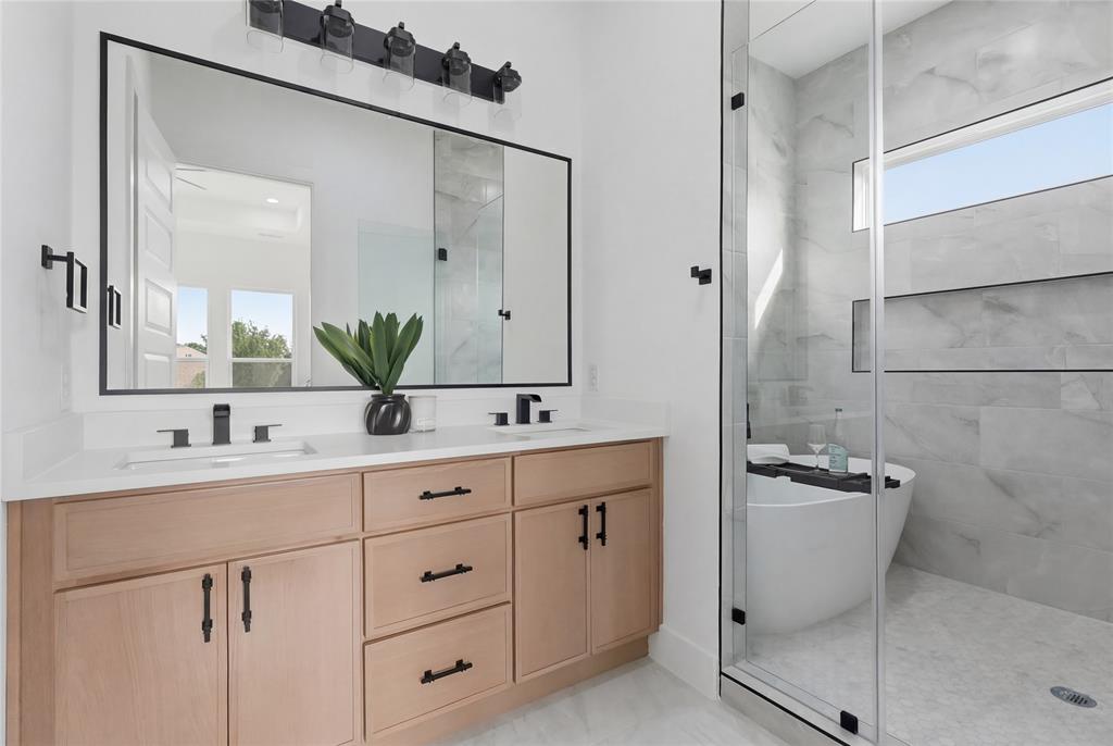 7817 Red Spring Road Dallas, TX 75241 - Photo 21 of 23 Full bath with double vanity and a stall shower