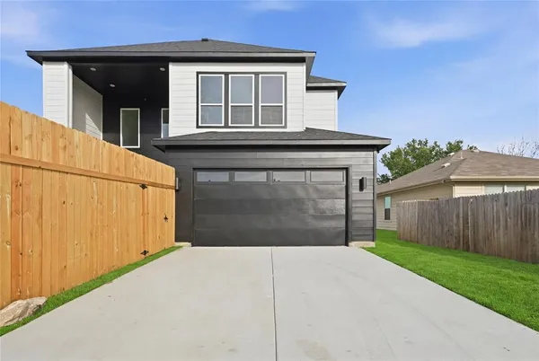 a front view of a house with a garage