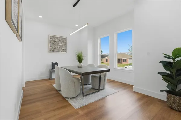 a kitchen with cabinets appliances and a sink