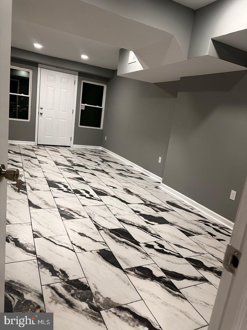 32 Kent Road Upper Darby, PA 19082 - Photo 13 of 60 a view of a livingroom with wooden floor and kitchen space