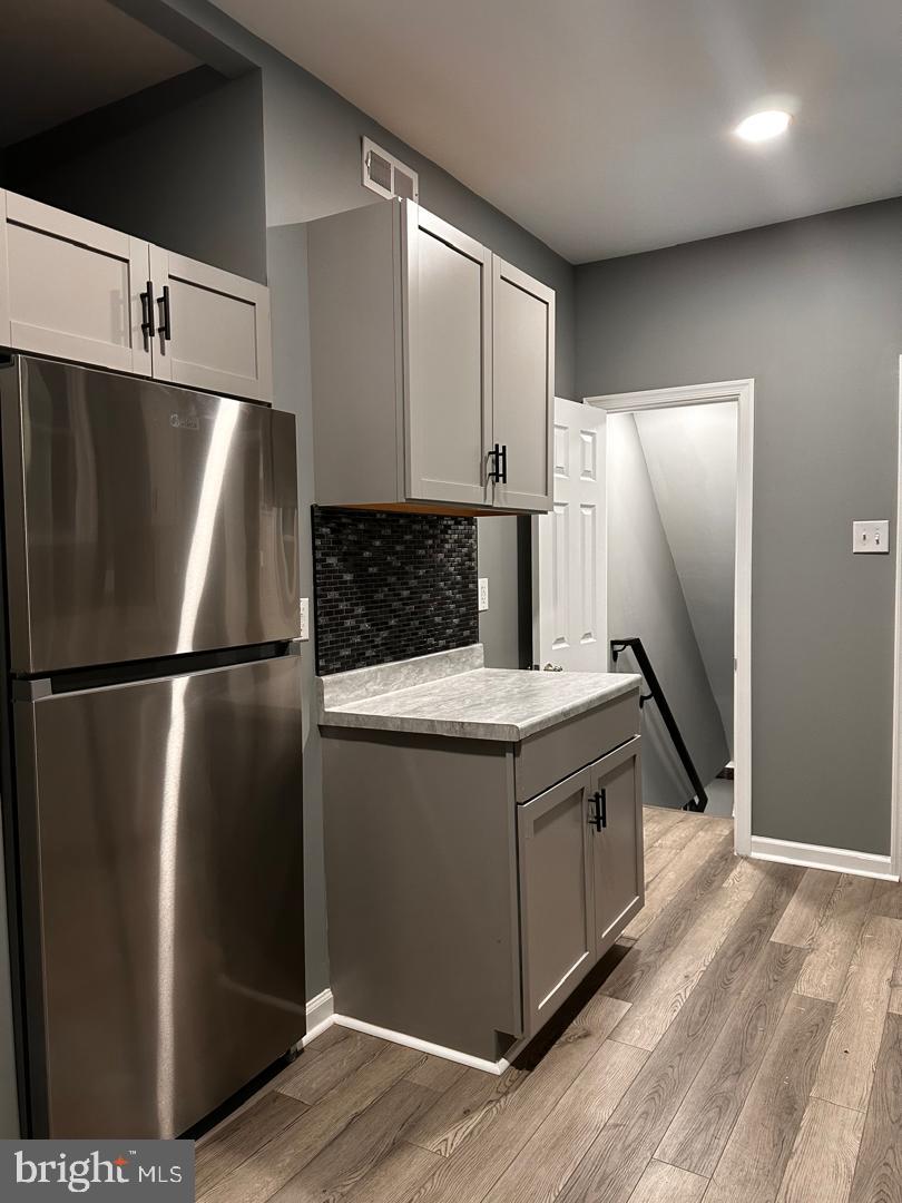 32 Kent Road Upper Darby, PA 19082 - Photo 22 of 60 a kitchen with stainless steel appliances granite countertop a refrigerator and a sink