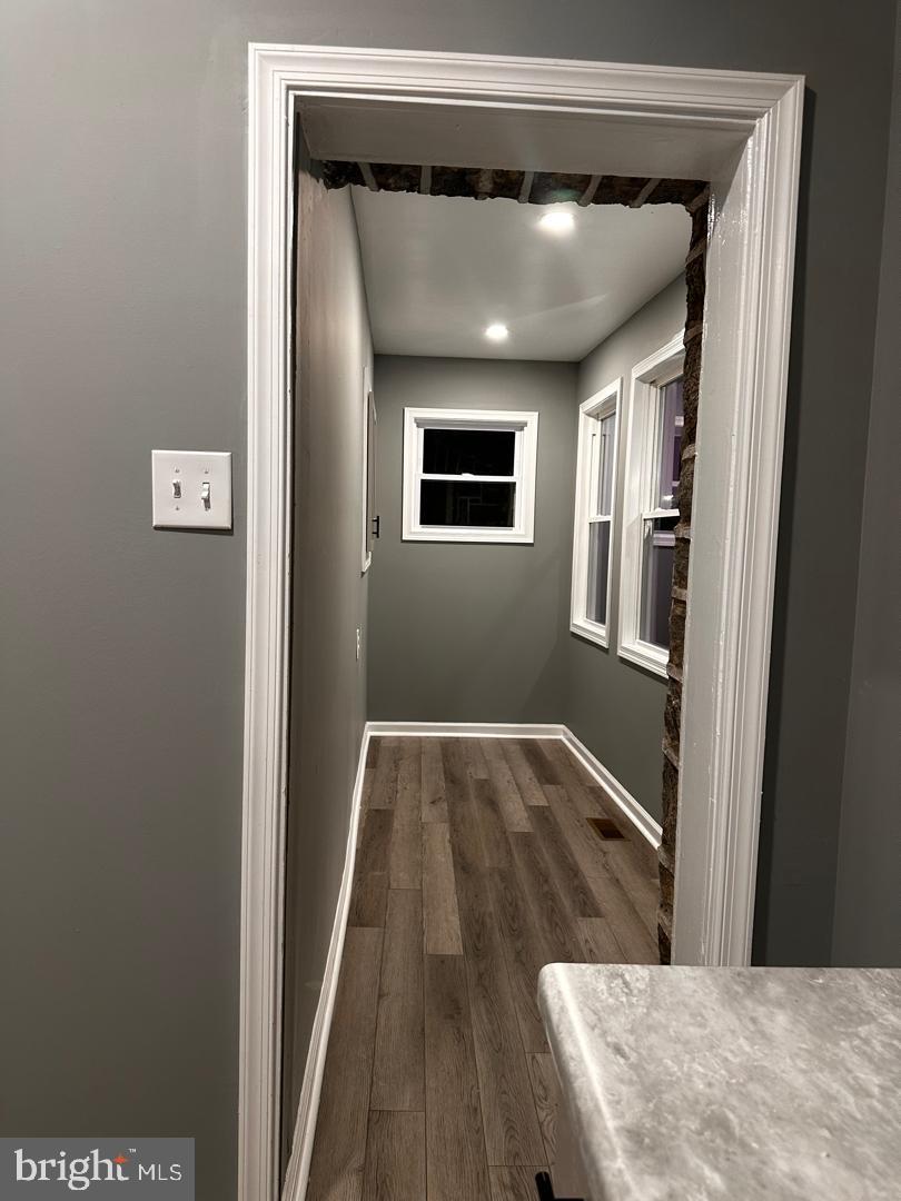 32 Kent Road Upper Darby, PA 19082 - Photo 26 of 60 a view of a hallway with wooden floor and staircase