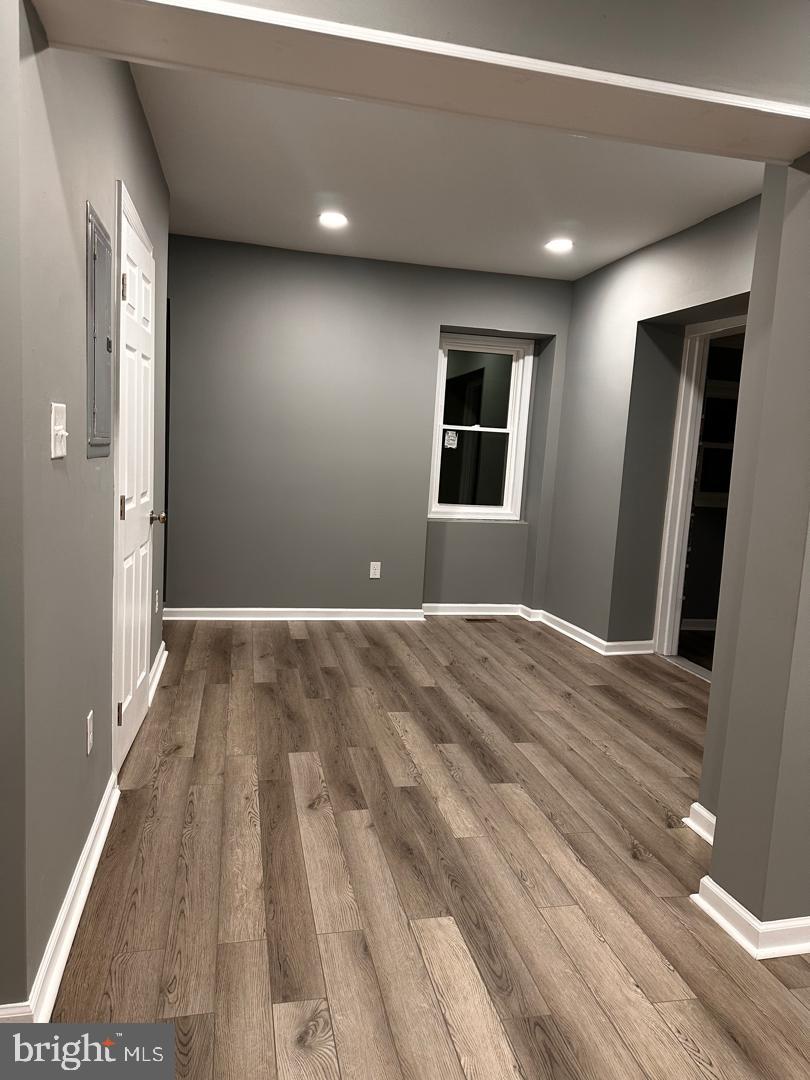 32 Kent Road Upper Darby, PA 19082 - Photo 28 of 60 a view of a livingroom with wooden floor and staircase