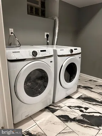 a bathroom with a sink mirror vanity and toilet