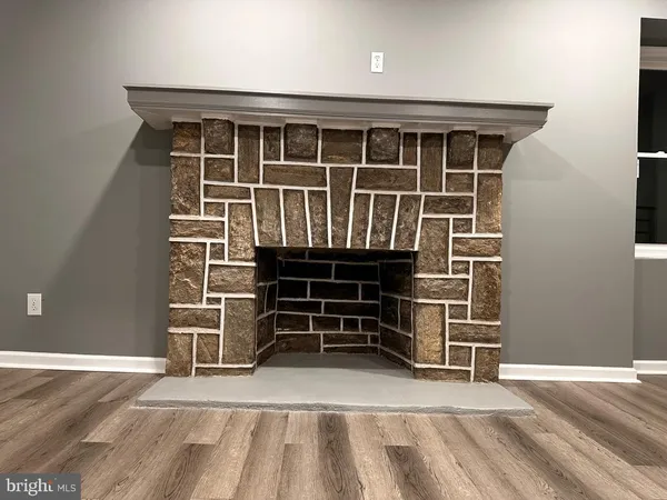 a view of a room that has a bed and a window