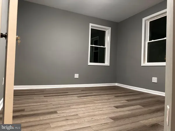 a view of front door with wooden floor