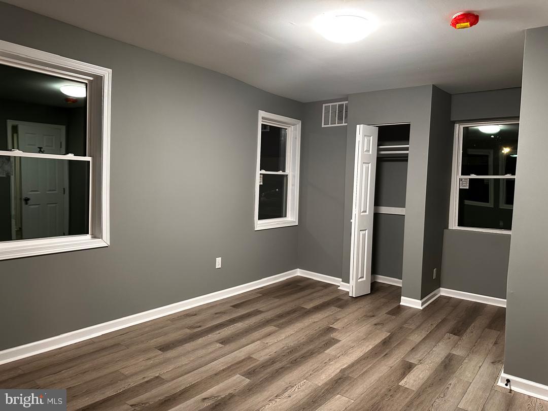32 Kent Road Upper Darby, PA 19082 - Photo 43 of 60 a view of an empty room with wooden floor and closet