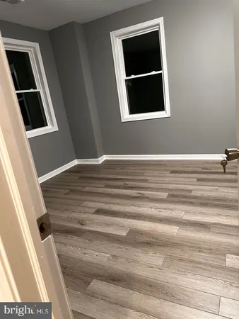 a view of a livingroom with wooden floor