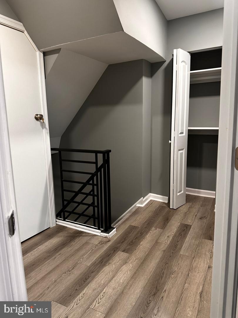 32 Kent Road Upper Darby, PA 19082 - Photo 45 of 60 a view of an empty room with wooden floor and closet