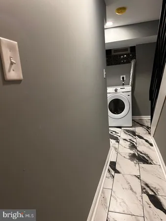a kitchen with stainless steel appliances a refrigerator and a stove top oven