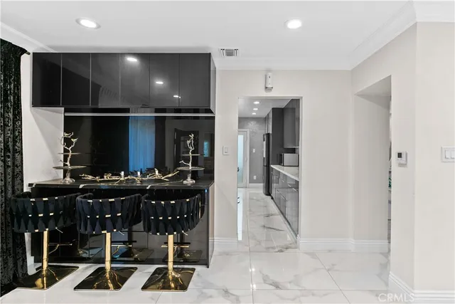 a kitchen with lots of counter space and windows