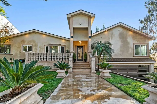 a front view of a house with a yard