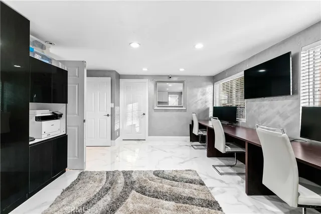 a spacious bathroom with a sink toilet and shower