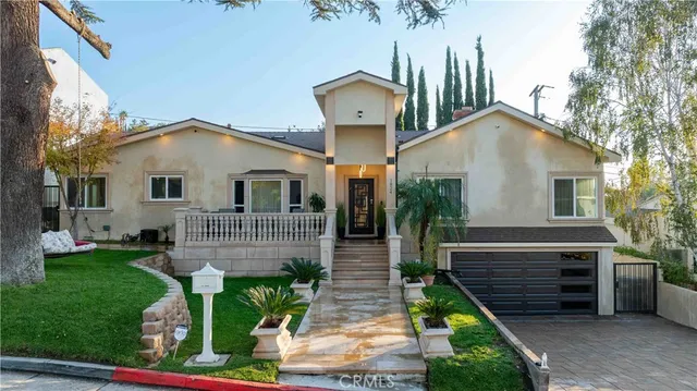 a front view of a house with garden