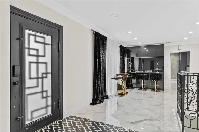 a view of kitchen with furniture and refrigerator