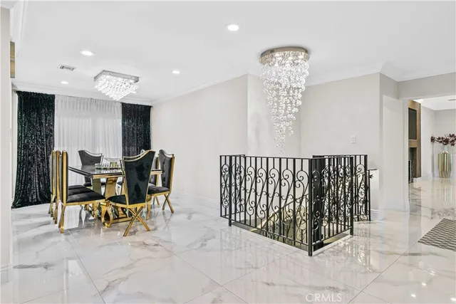 a view of a hallway with workspace and dining room view