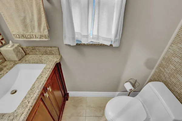 a bathroom with a sink and toilet