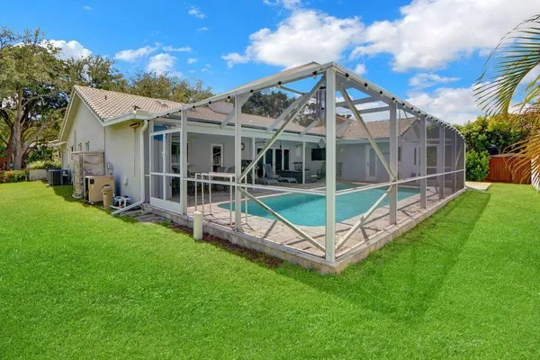 a view of a house with a backyard