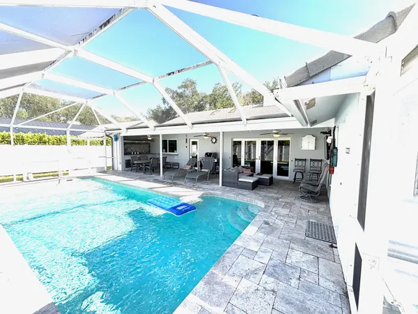 a view of a swimming pool with a patio