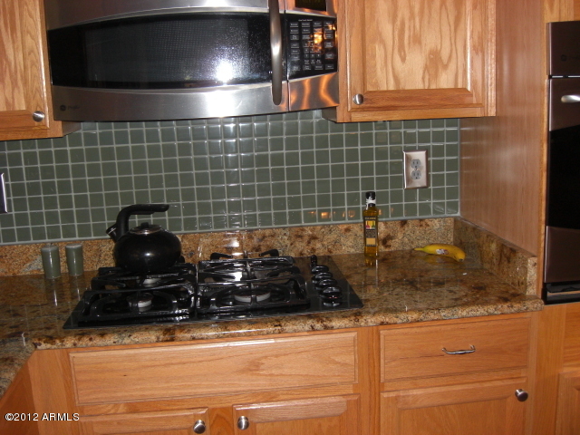 295 West Del Rio Street Gilbert, AZ 85233 - Photo 4 of 30 cooktop and microwave