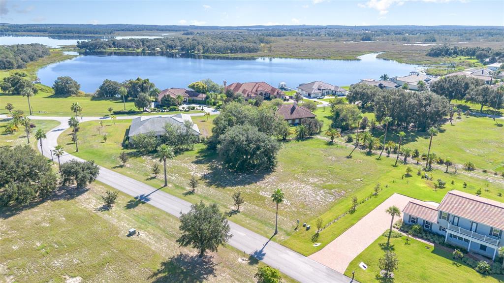 7434 Jasmine Street Groveland, FL 34736 - Photo 2 of 15 an aerial view of lake residential houses with outdoor space