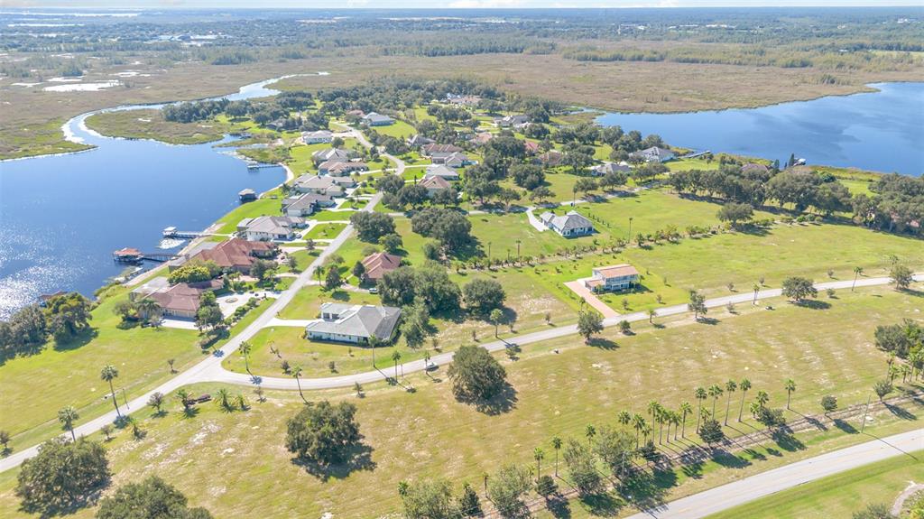 7434 Jasmine Street Groveland, FL 34736 - Photo 6 of 15 an aerial view of ocean beach and residential houses with outdoor space