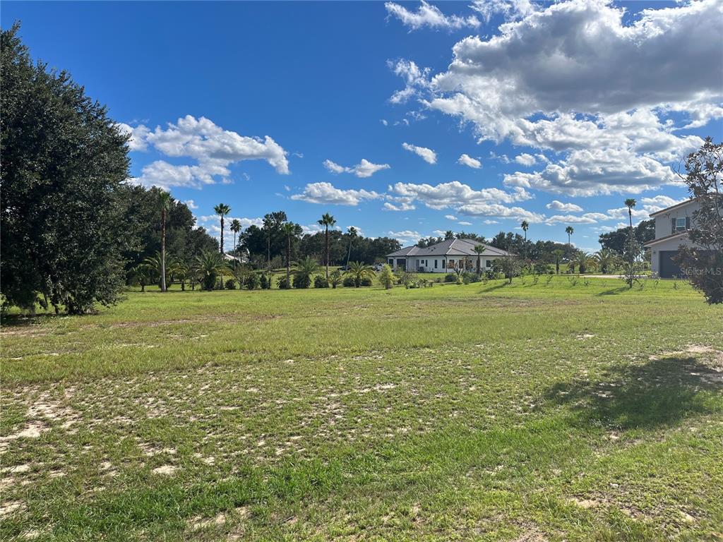 7434 Jasmine Street Groveland, FL 34736 - Photo 10 of 15 a view of a building with a big yard