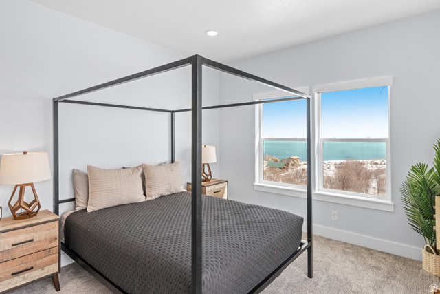 1343 North Trapper Loop Garden City, UT 84028 - Photo 7 of 56 Bedroom with a water view and carpet floors