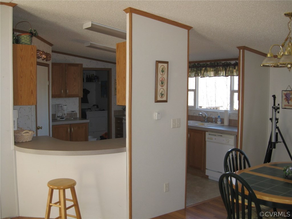 48 Reservoir Road Victoria, VA 23974 - Photo 9 of 26 a kitchen with a refrigerator a sink and a dining table