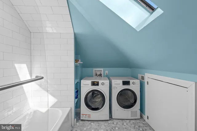 a utility room with dryer and washer