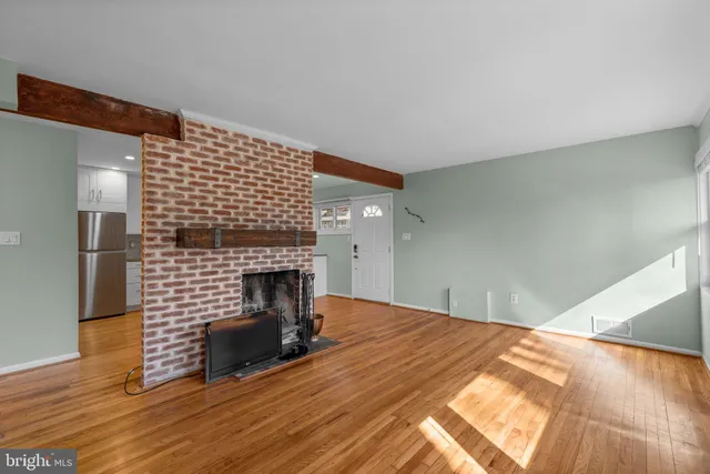 a bedroom with a bed and a fireplace